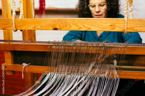 Close up view of weaving threads in handloom photo