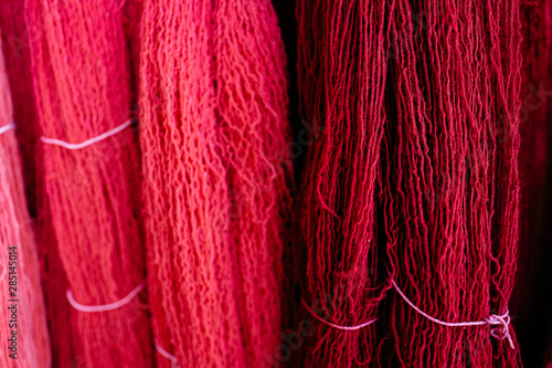 Close up of two different colors of wool