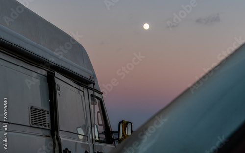 Tumblr camper caravan at the beach sunrise moon pink sky © Sonya