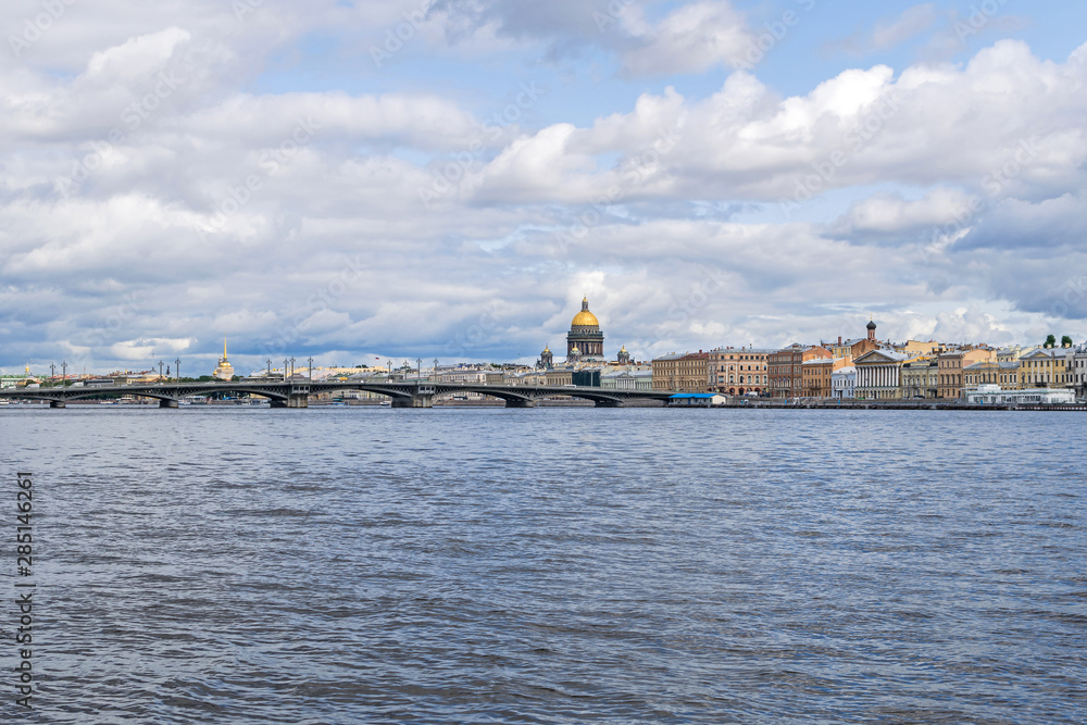 River Bolshaya Neva with  the Blagoveshchenskiy bridge and the Saint Isaac's Cathedral in Saint Petersburg, Russia