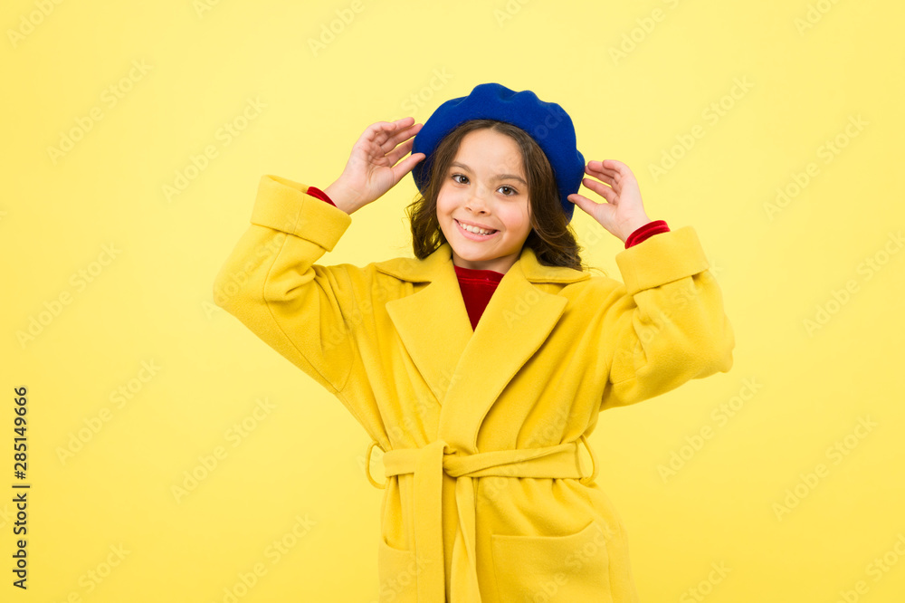 Autumn joy. happy childhood. small child with curly hair. cheerful little girl in yellow coat. parisian girl kid in french beret. autumn fashion style. fall season. beauty and fashion. autumn coat Autumn joy. happy childhood. small child with curly hair. cheerful little girl in yellow coat. parisian girl kid in french beret. autumn fashion style. fall season. beauty and fashion. autumn coat
