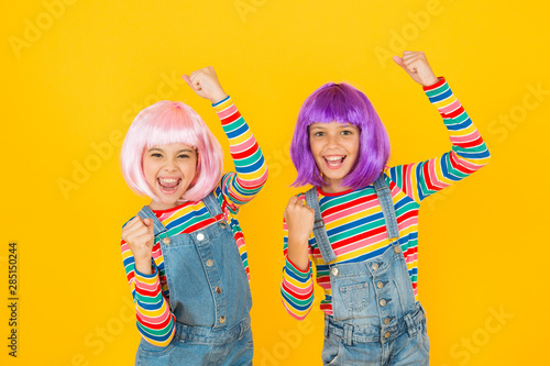 Anime convention. Anime cosplay party concept. Animation style characterized colorful graphics vibrant characters fantastical themes. Happy little girls. Anime fan. Cheerful friends in colorful wigs