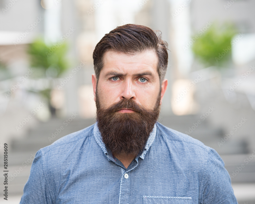 Feeling manly. Caucasian guy. Styling beard and moustache. Facial hair treatment. Hipster with beard brutal guy. Beard grooming. Brutality and beauty. Masculinity concept. Barber shop beard grooming Feeling manly. Caucasian guy. Styling beard and moustache. Facial hair treatment. Hipster with beard brutal guy. Beard grooming. Brutality and beauty. Masculinity concept. Barber shop beard grooming