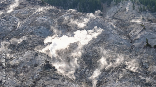 shot of steam rising from burning mountain in yellowstone