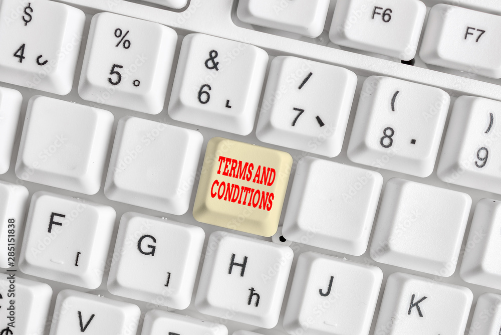 Conceptual hand writing showing Terms And Conditions. Concept meaning rules that apply to fulfilling a particular contract White pc keyboard with note paper above the white background Conceptual hand writing showing Terms And Conditions. Concept meaning rules that apply to fulfilling a particular contract White pc keyboard with note paper above the white background