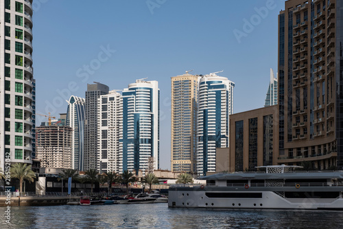 DUBAI, UAE - may 2019: View of modern skyscrapers shining in sunrise lights in Dubai Marina in Dubai, UAE. © Сергій Вовк