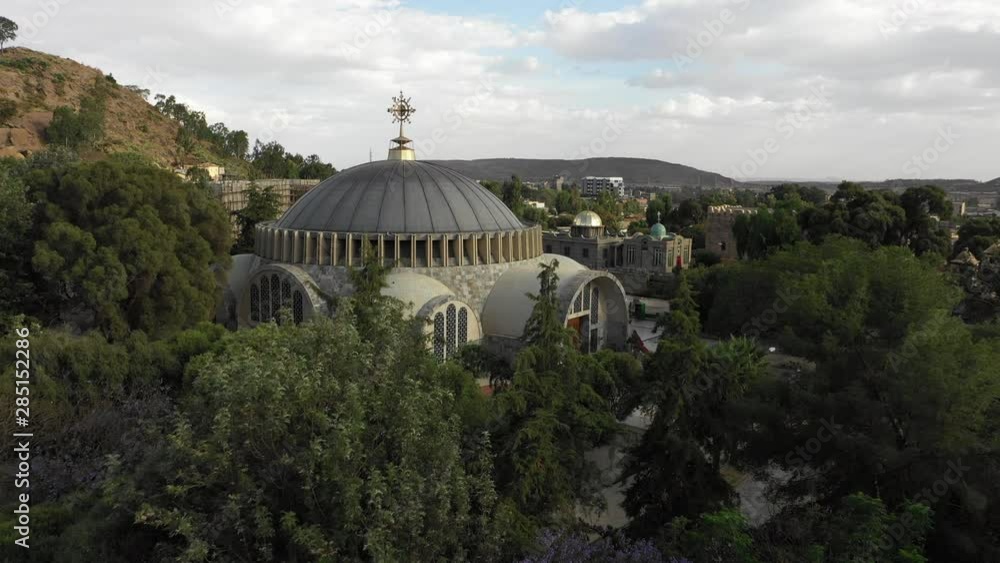 Drone flight over trees reveals beautiful rebuilt Church of Our Lady