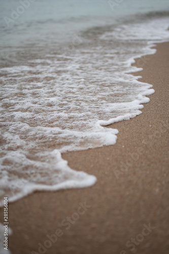 Close-up of Foamy Water Rolling into Shore in Fort Lauderdale