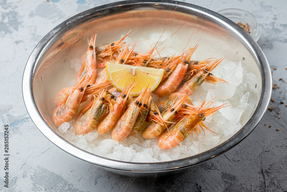 boiled shrimp on ice with smoke on grey concrete table boiled shrimp on ice with smoke on grey concrete table