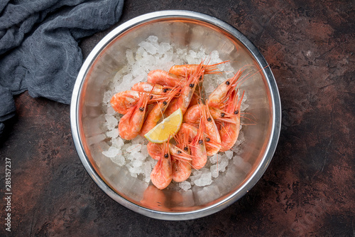 boiled shrimp on ice on dark concrete rustic table