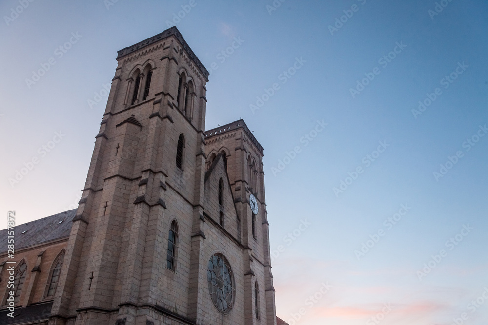 Eglise Saint Jean Baptiste Church at dusk in Bourgoin Jallieu, France, a city of Dauphine region, in Isere Departement. It is the main catholic church of this city, built in the 19th century