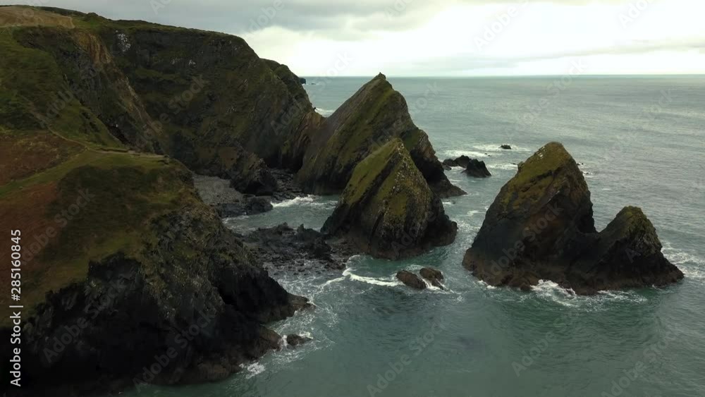 The drone flies above the rocky coastline. The drone flies above the rocky coastline.