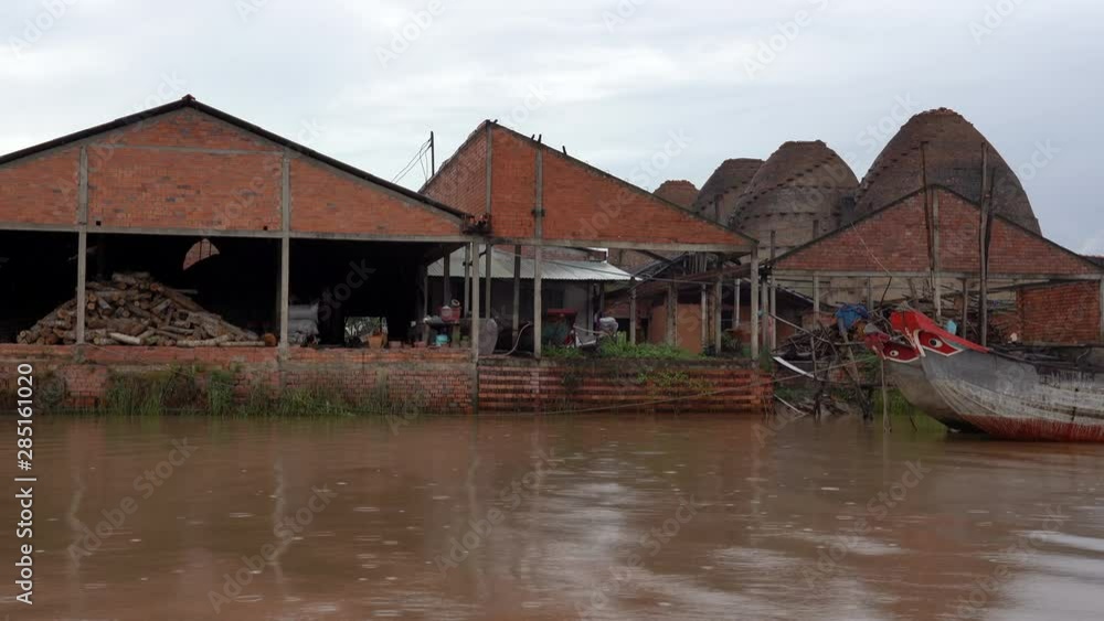 MEKONG DELTA, VIETNAM - floating near pottery factory MEKONG DELTA, VIETNAM - floating near pottery factory