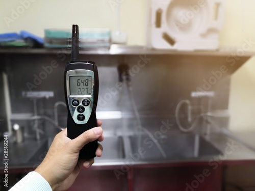Technician checking Temperature and Humidity in central sterile supply department.Cleanroom and operating room Concept.