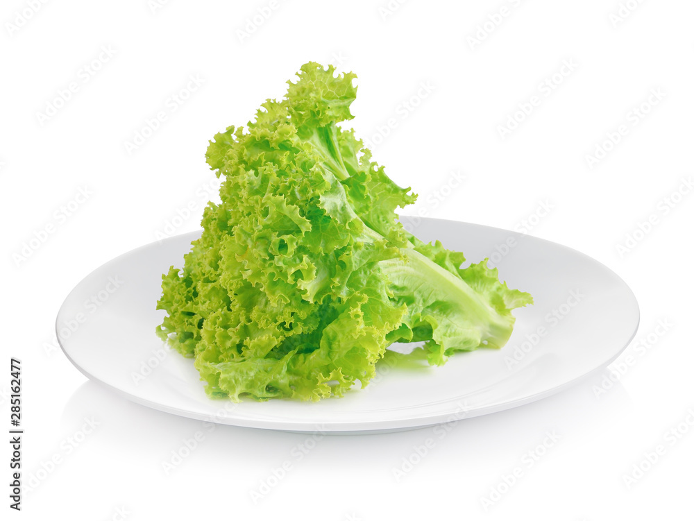 Fresh lettuce leaves isolated on white plate Fresh lettuce leaves isolated on white plate