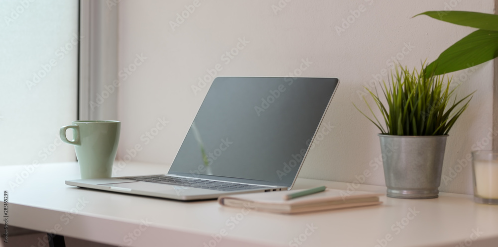 Open blank screen laptop computer with coffee cup Open blank screen laptop computer with coffee cup