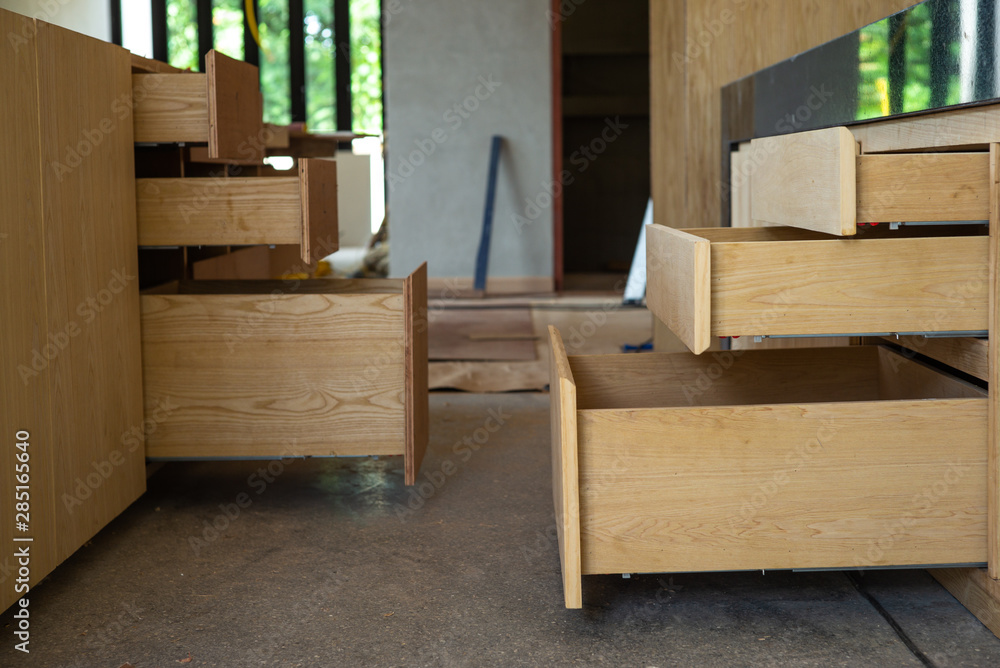 Opening wooden shelfs under installation inside the house under construction Opening wooden shelfs under installation inside the house under construction