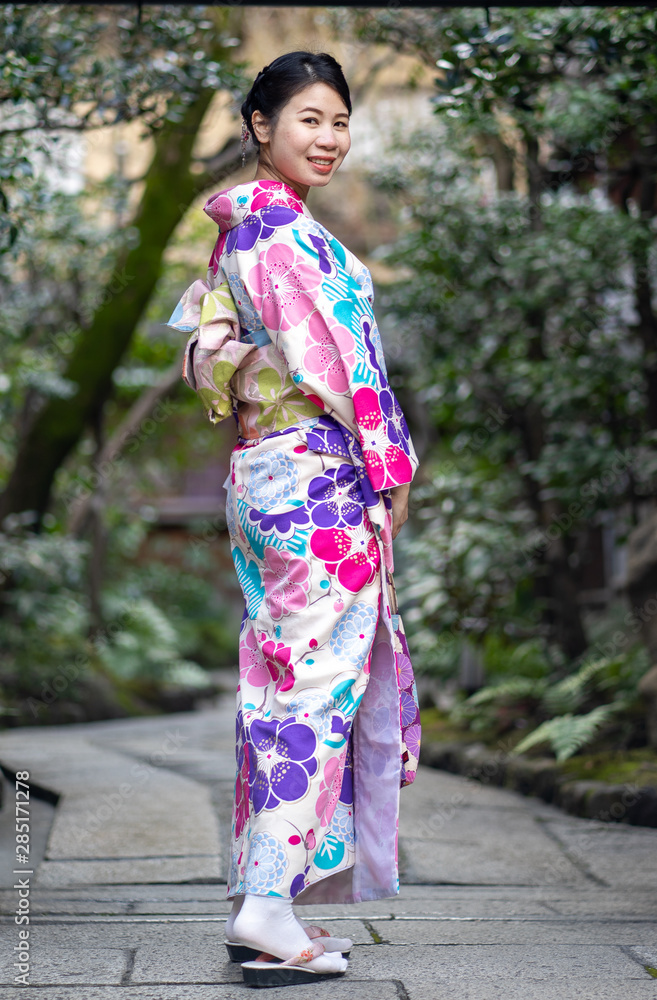 Women Floral Printed Long Kimono in Gion House is an old wooden, traditional style at Gion Shijo Kyoto Japan. Women Floral Printed Long Kimono in Gion House is an old wooden, traditional style at Gion Shijo Kyoto Japan.