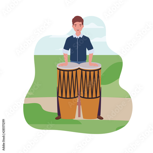 young man with congas in background landscape photo