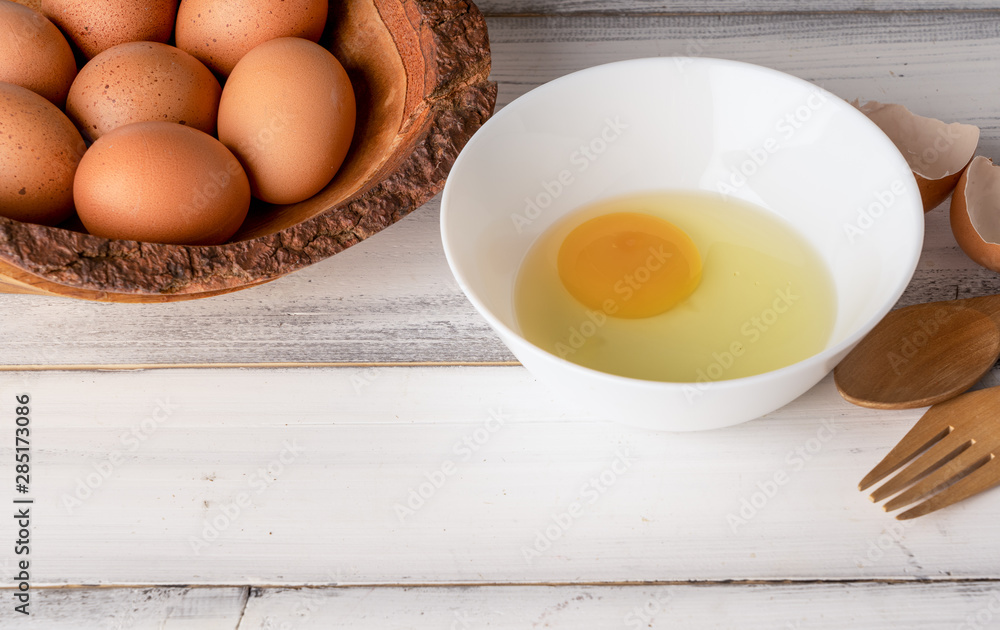 Fresh chicken eggs on white wooden table background. Fresh chicken eggs on white wooden table background.