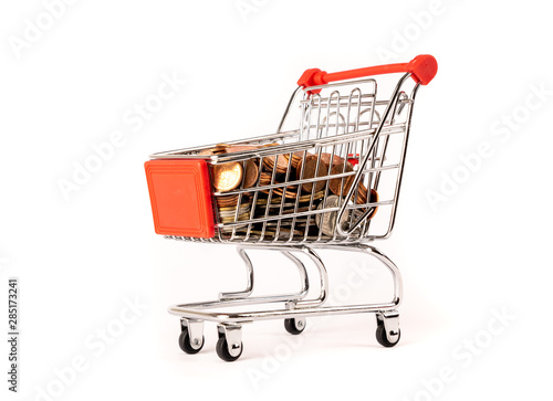 coins money and shopping cart or supermarket trolley business finance shopping concept on white background.