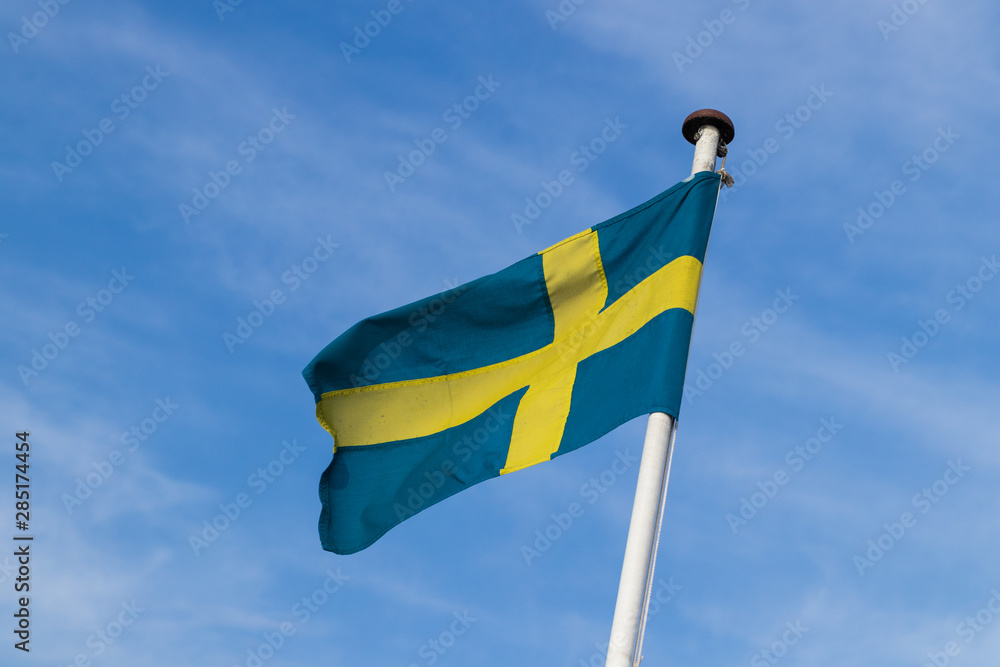 Swedish flag on the ferries going out to the island of Ven in southern Sweden during summer. Swedish flag on the ferries going out to the island of Ven in southern Sweden during summer.