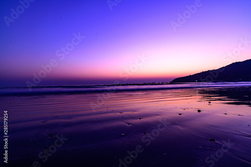 Serene evening beach calm waters 