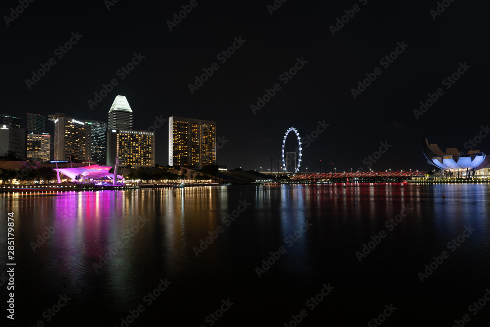 SINGAPORE - MAY 19, 2019: View of the Downtown Singapore skyline and Marina Bay at night.