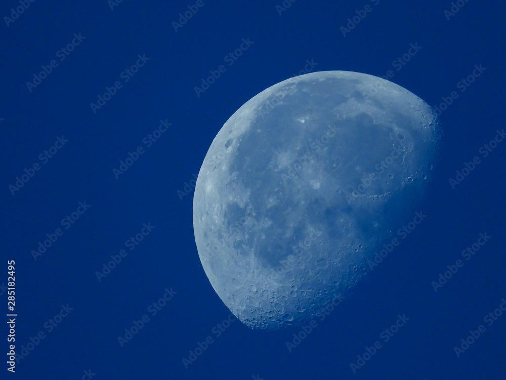 a very dense close-up of a decreasing moon in the morning sky a very dense close-up of a decreasing moon in the morning sky