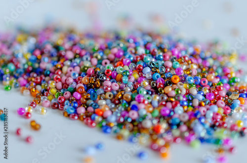 Fototapeta Mix of colorful seed beads, texture background