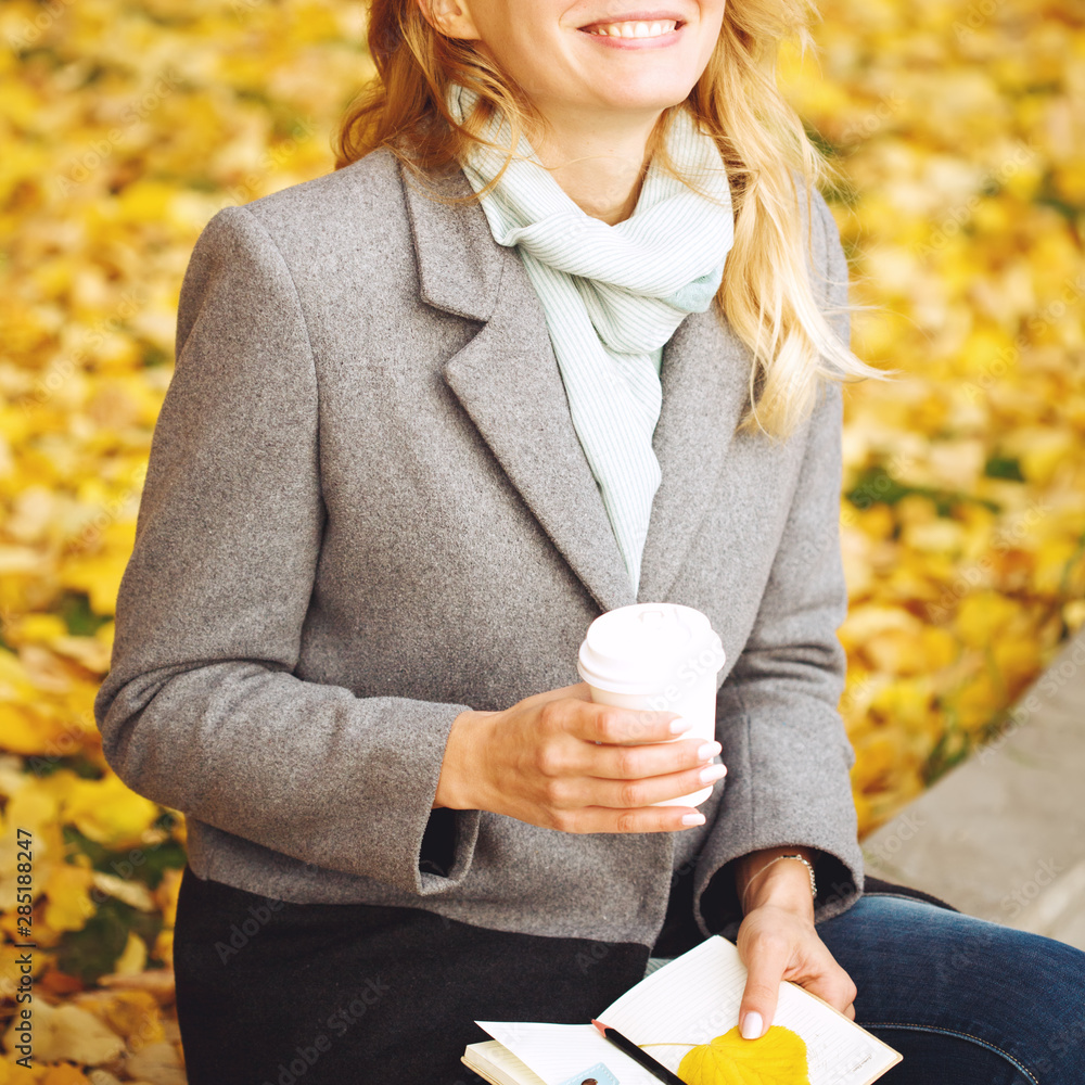 Happy creative woman in autumn sunny day