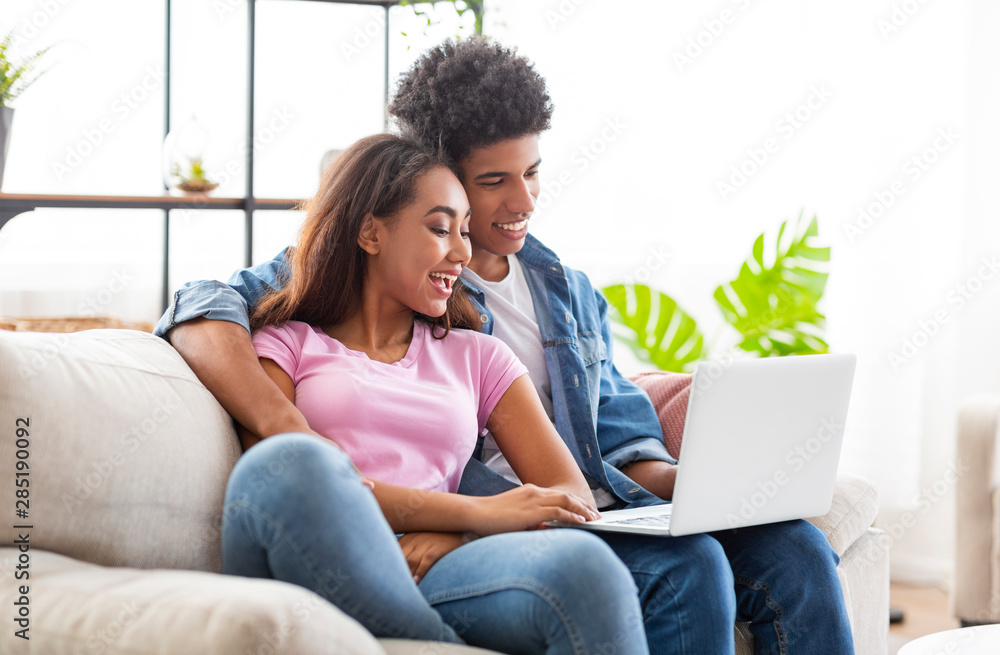 Black couple making video call with their absent mate Black couple making video call with their absent mate