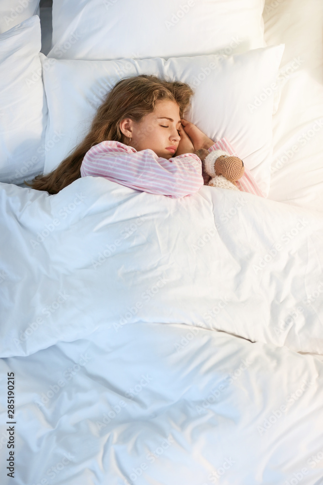 Teenage girl sleeping in bed at night Teenage girl sleeping in bed at night