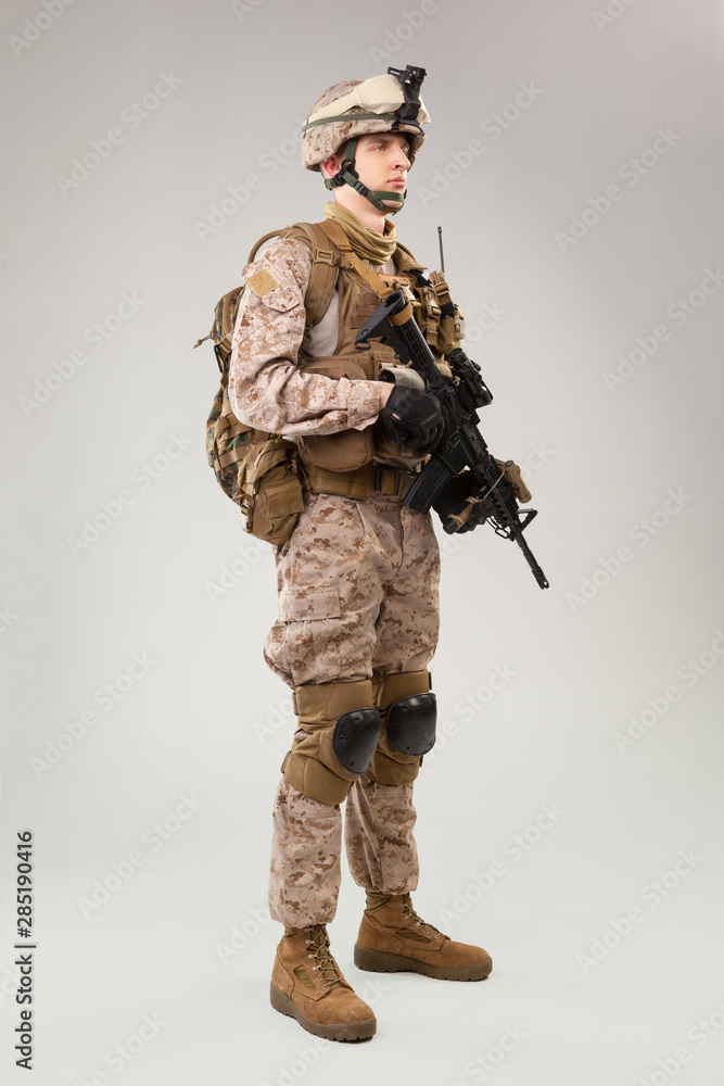 United states Marine Corps special operations command raider with weapon. Studio shot United states Marine Corps special operations command raider with weapon. Studio shot