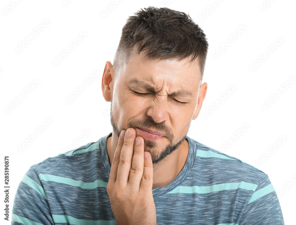 Man suffering from toothache against white background Man suffering from toothache against white background