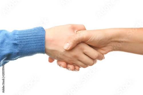 Women shaking hands on white background © Pixel-Shot