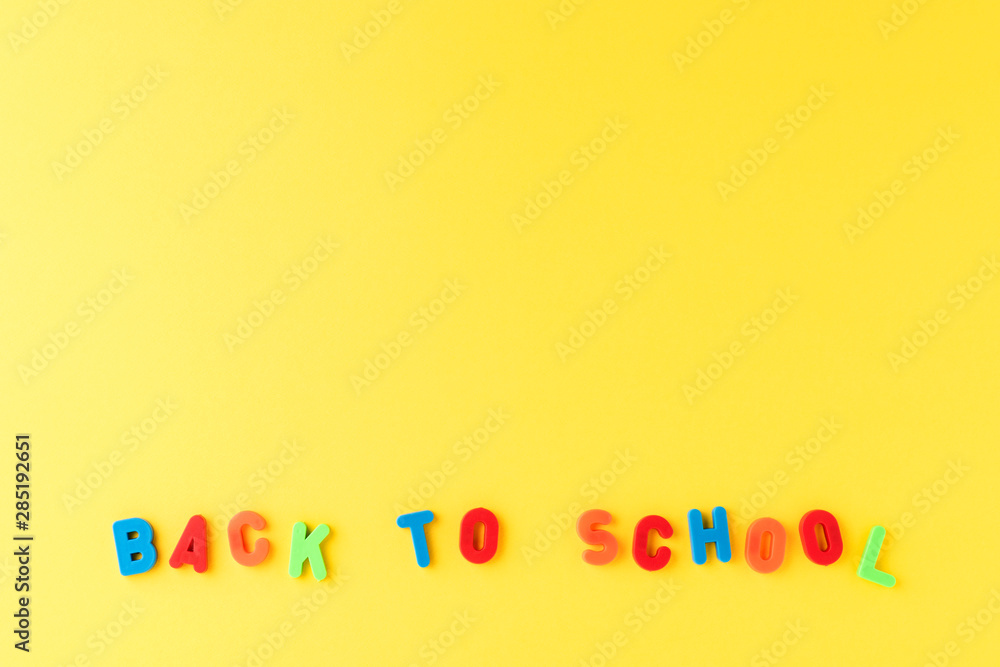 Back to school. Text on yellow background with copyspace Back to school. Text on yellow background with copyspace