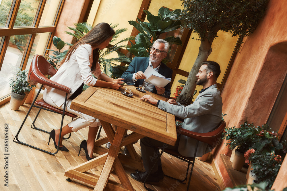 Let's talk about it. Businesspeople discussing new ideas during lunch break Let's talk about it. Businesspeople discussing new ideas during lunch break