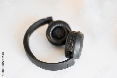 black headphones on a white background on the table