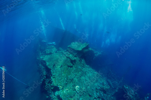 Shipwreck in underwater with air bubbles. Diving in ocean