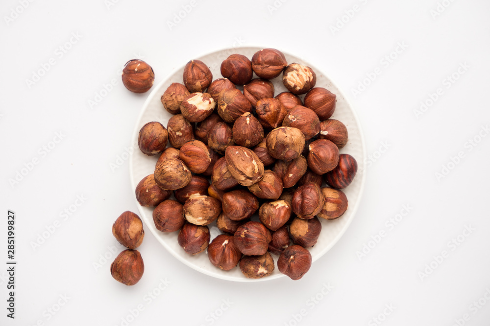 nutritious nuts, hazelnuts on a white background nutritious nuts, hazelnuts on a white background