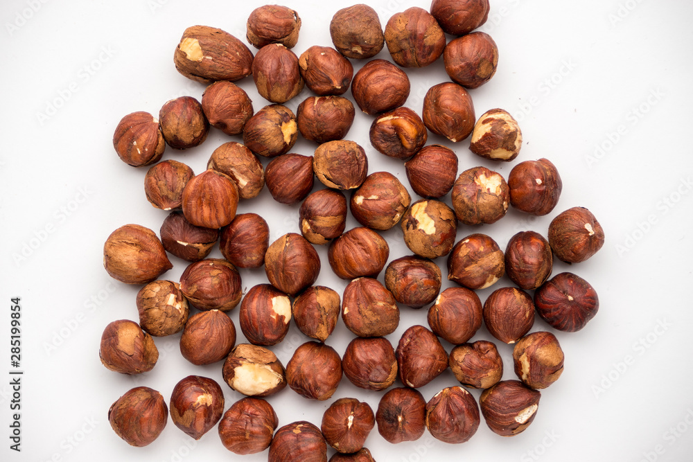 nutritious nuts, hazelnuts on a white background nutritious nuts, hazelnuts on a white background