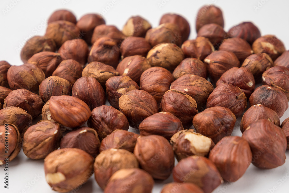 nutritious nuts, hazelnuts on a white background nutritious nuts, hazelnuts on a white background