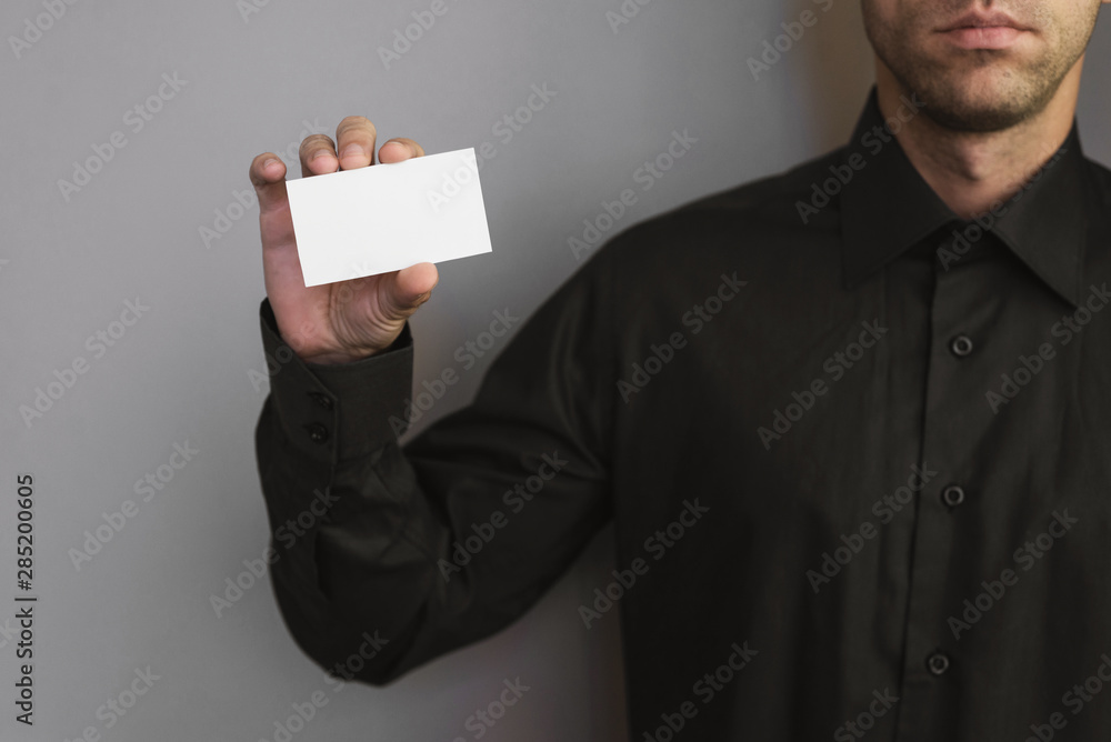 Man holding a business card. Place for a text. Man holding a business card. Place for a text.