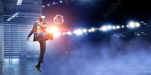 Black Man and Virtual Reality Soccer Match © Sergey Nivens