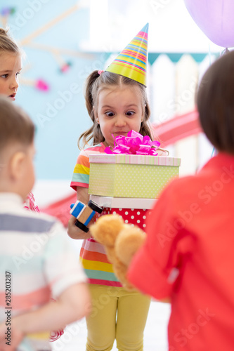Surprised kid girl taking f...