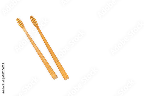 Bamboo toothbrush on white background.