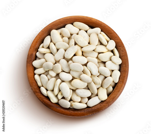 White beans in wooden bowl isolated on white background
