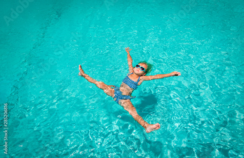 little girl relax in water on beach or pool  vacation