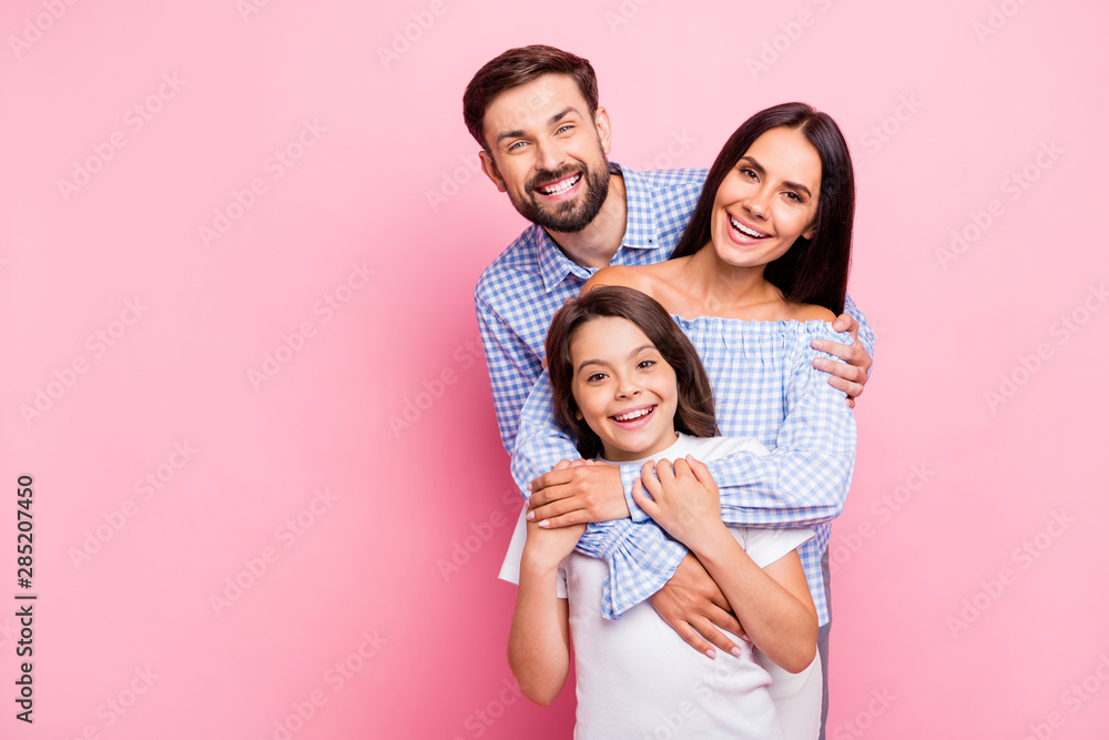 Portrait of funny family laughing wearing plaid shirts off-shoulders white t-shirt isolated over pink background Portrait of funny family laughing wearing plaid shirts off-shoulders white t-shirt isolated over pink background